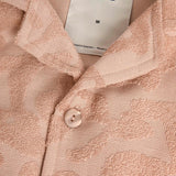 Close up of top button and part of collar