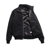 Front of a black turtleneck sweater jacket, fully unzipped, with the right side pulled back to show black satin lining.