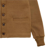 Close up of bottom hem, buttons, welt pocket, and sleeve opening