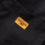Close up of Service Works label on tote bag in black