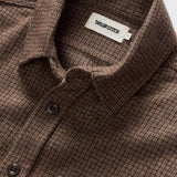 Close up of upper portion of shirt to show buttons and collar