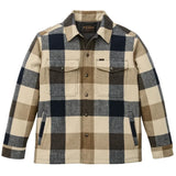 Front of wool jacket in a cream and navy plaid with snap closures going down the center, two chest pockets with snap-secured flaps, and two hand warmer pockets