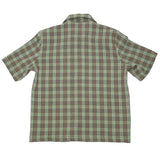 Back of short sleeved shirt in a green and brown plaid fabric.