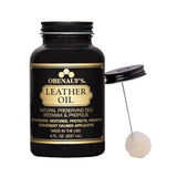 Jar of Obenauf's Leather Oil next to applicator