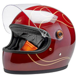 Angled side profile of Gringo S Helmet in gloss red flames with clear visor up