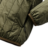 Close up of sleeve opening, front pocket, and bottom hem