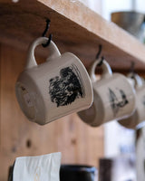 Display of hanging Fontenelle Diner Mugs