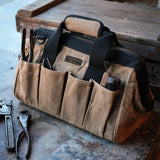 Waxed Canvas Tool Bag with tools in it on tool bench