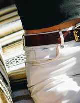 Close up of waistband and front pocket on model