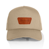 Leather patch trucker hat in tan