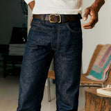 Close up of man wearing dark indigo denim