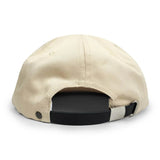 Back of ecru baseball hat with a black leather adjustable strap