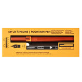 A boxed fountain pen set on a yellow-orange background. The packaging shows the text 'STYLO À PLUME | FOUNTAIN PEN' and the brand 'ARODIA' with a black fountain pen pictured through a clear window.