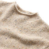 Close up of ribbed mock neck collar of beige sweater
