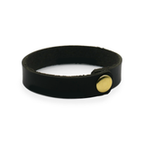 black leather wrist wrap with brass snap