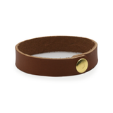 Dark brown leather wrist wrap with brass snap