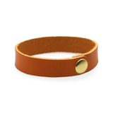 Tan leather wrist wrap with brass snap